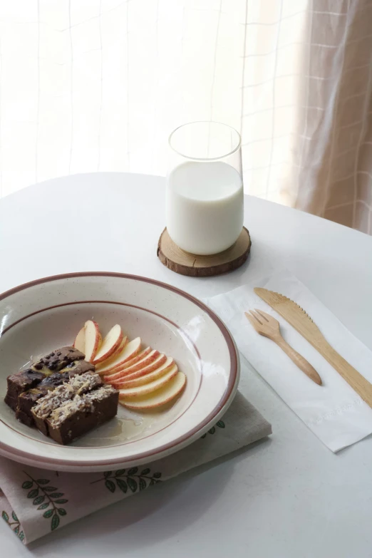 a close up of a plate of food with apples