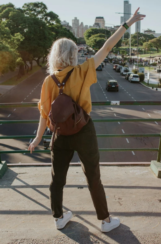 a woman stands on top of the stairs to reach high