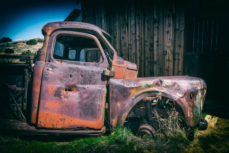 an old pick up truck is in the yard