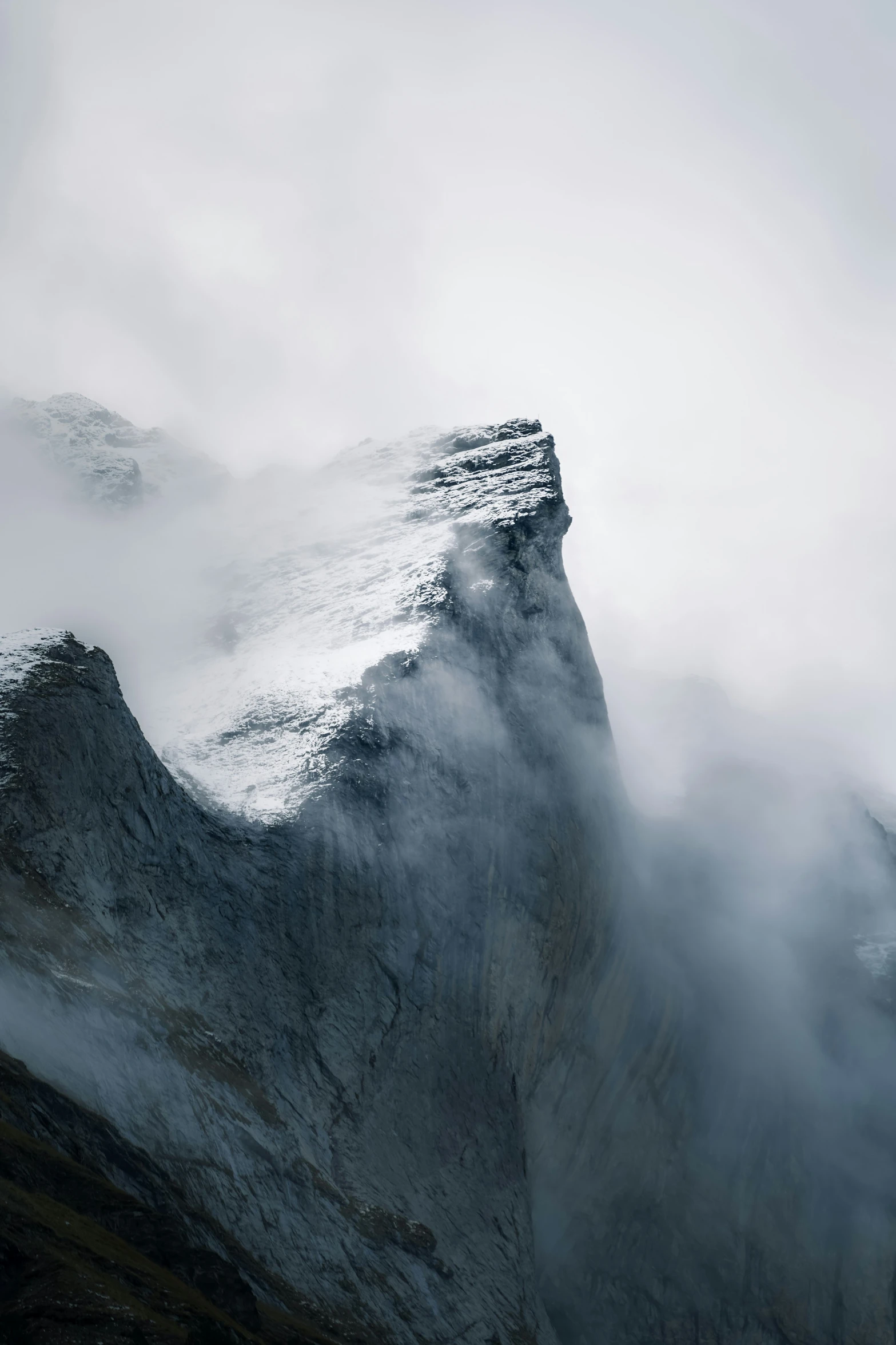 mountains with fog around them and in the air