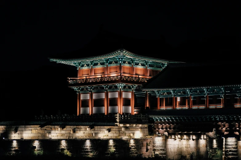 a building with lots of windows in the dark