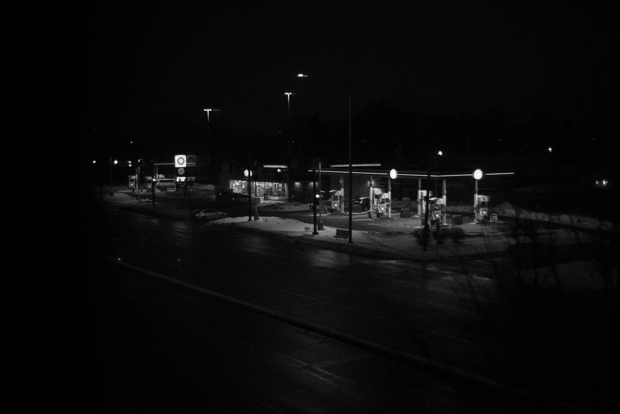 black and white po of street lights at night