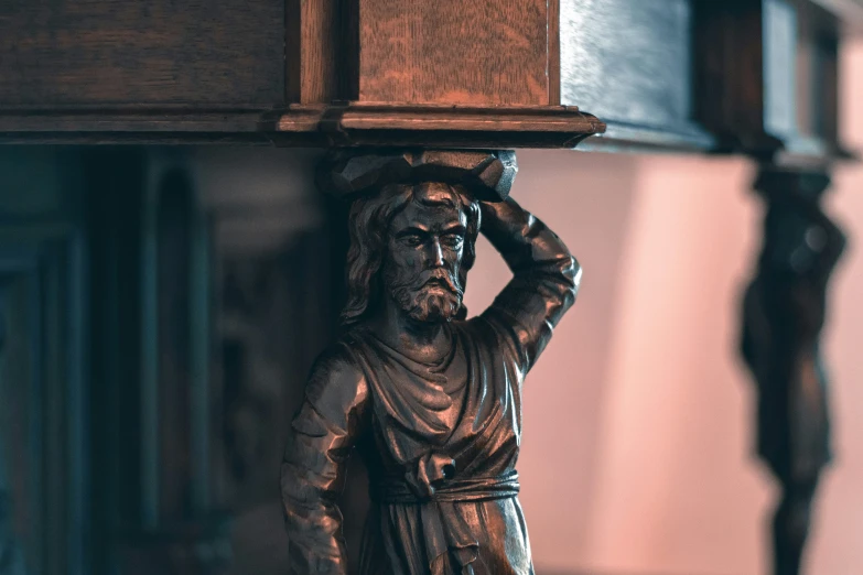 a statue of jesus sitting on top of a table