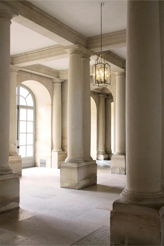 a room with some pillars and lights