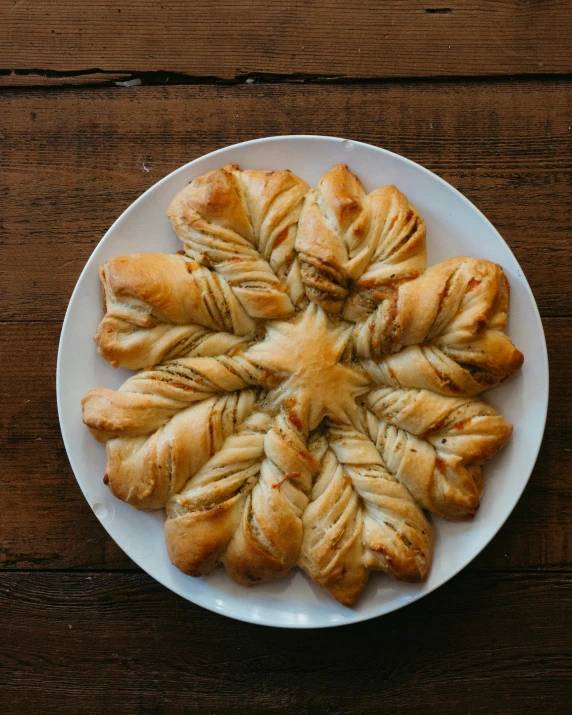 a plate of freshly baked pastries on a wooden table