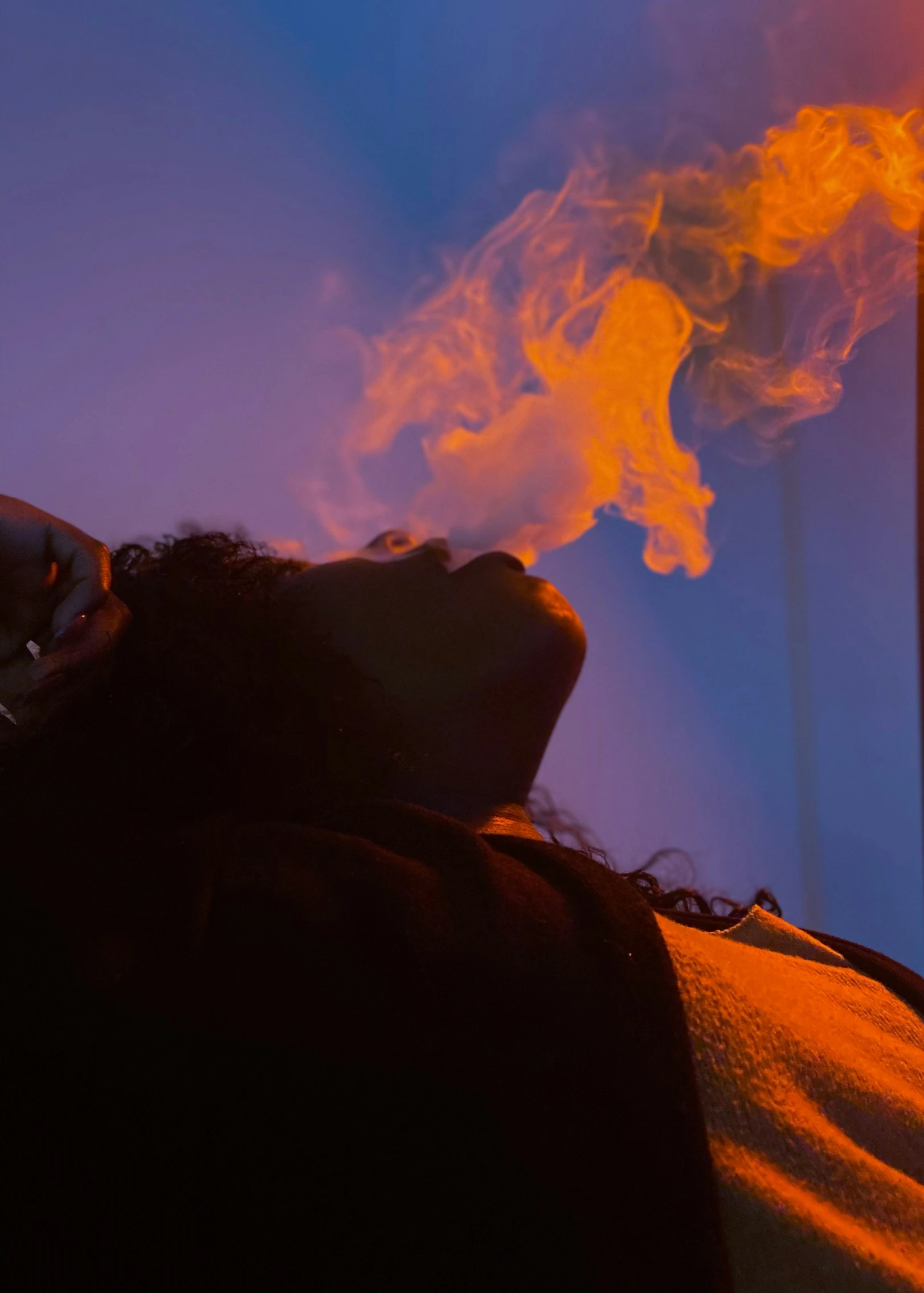 woman relaxing under a  lamp with smoke coming out