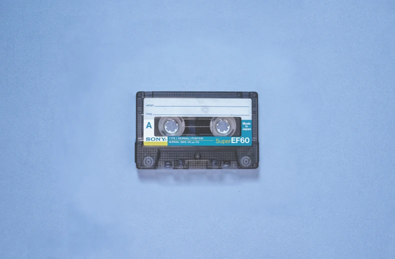 an old radio cassette is laying on the ground