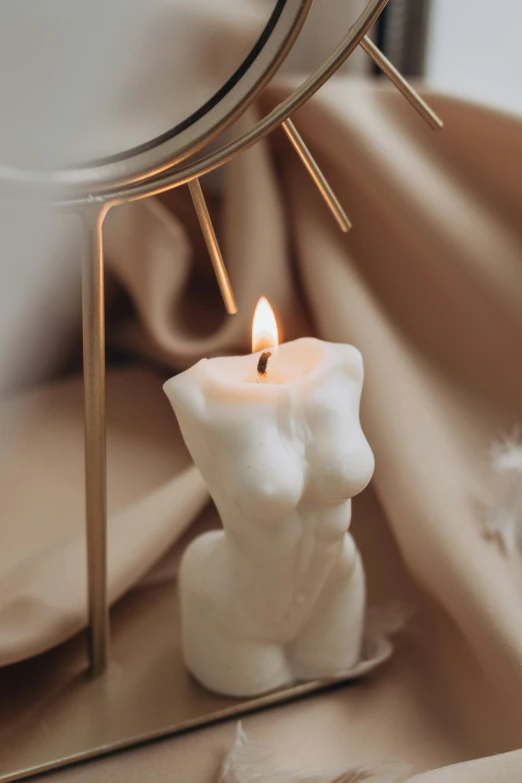 a small candle sitting on top of a table