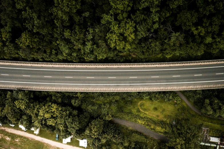 an overhead po of a road near trees