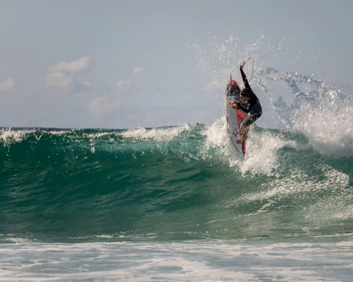 a person is surfing on the waves of an ocean