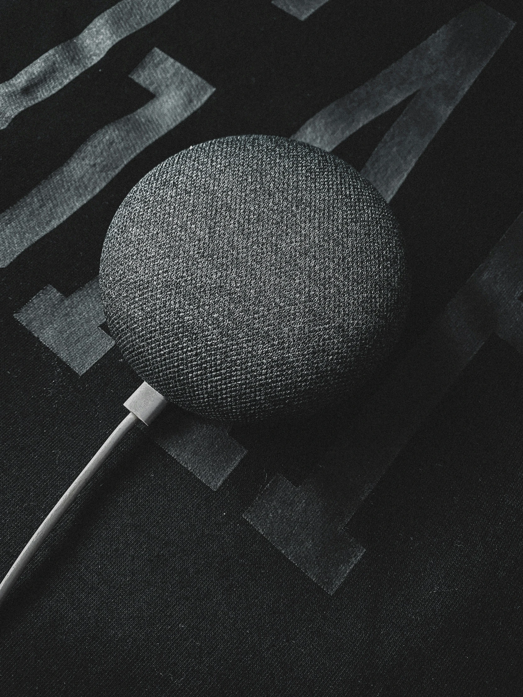 a microphone sitting on top of a black floor