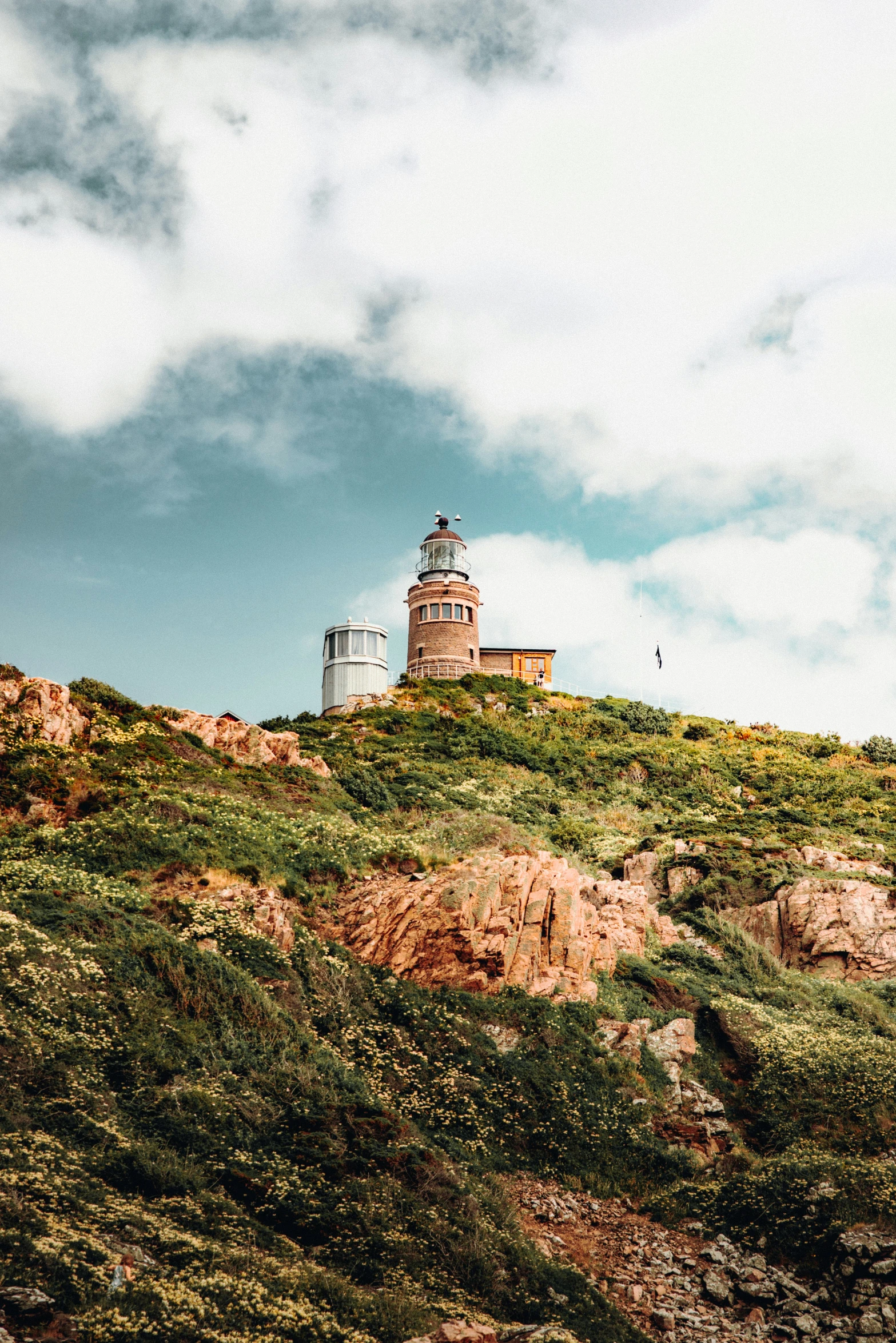 a tower sits on top of the hill