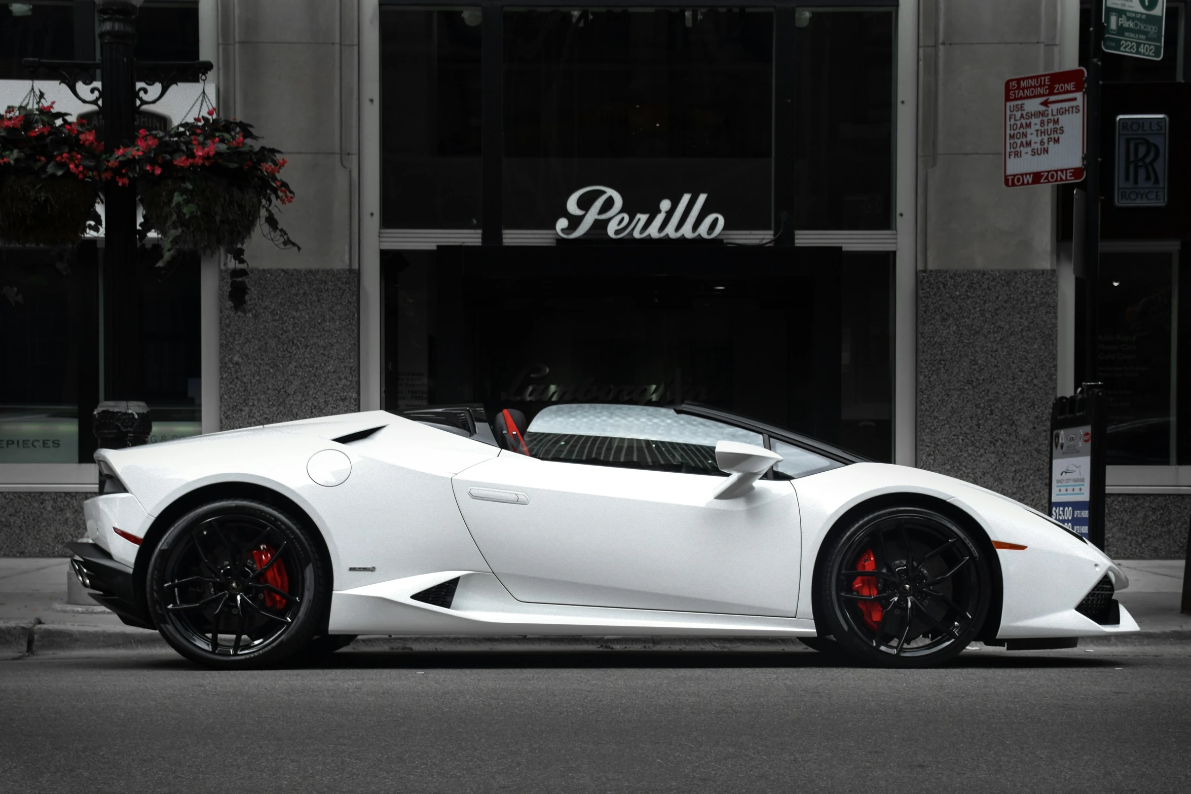 a car parked on the street near a building