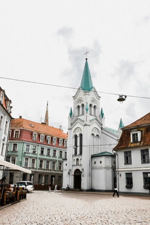 several tall buildings in the middle of an old town