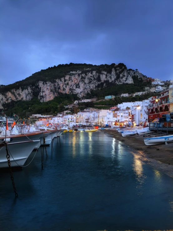 a marina with boats sitting on the dock