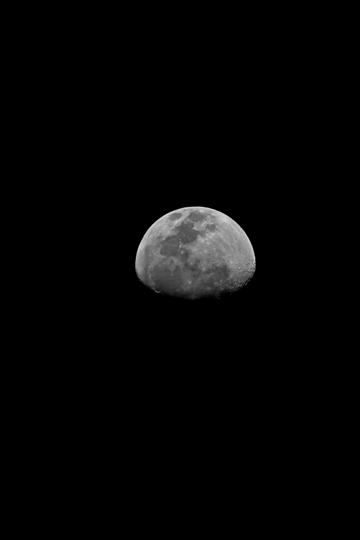 the moon is in the dark sky and some trees