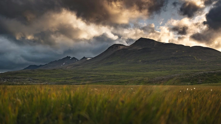 an image of a cloudy sky and the mountains