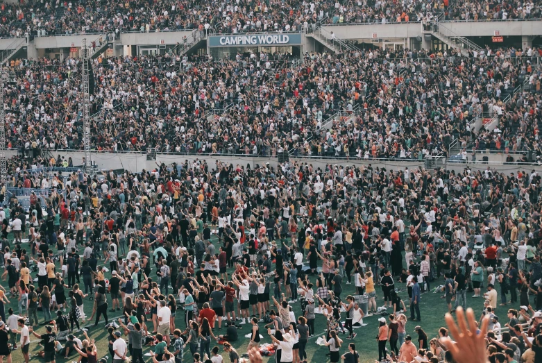 many fans at a baseball game in the stands