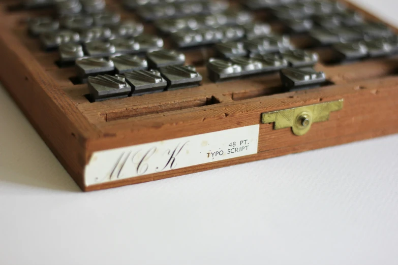 a keyboard on a wooden table with some signs