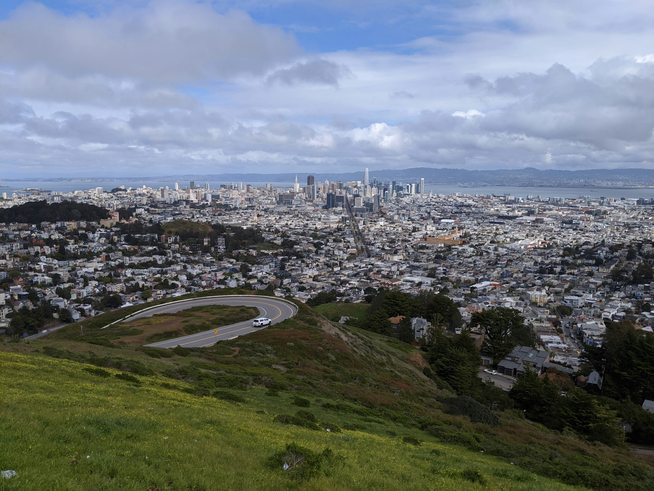 a view of a city from the top of a hill