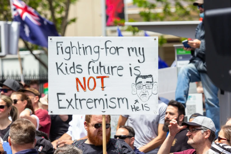 a protest with a sign that says fighting for my s future is not extresism