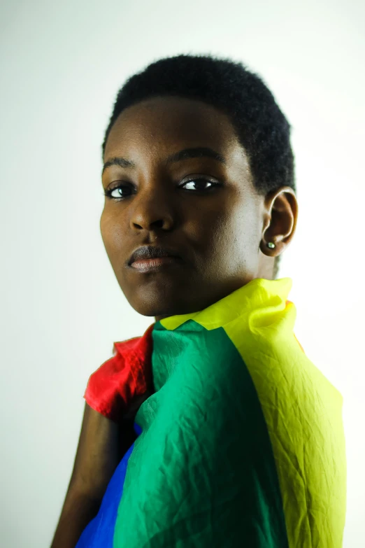 a girl with different colors holding a shirt