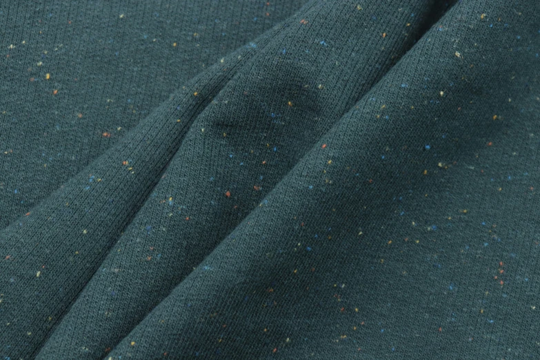 the fabric is very dark green with colorful spots on it