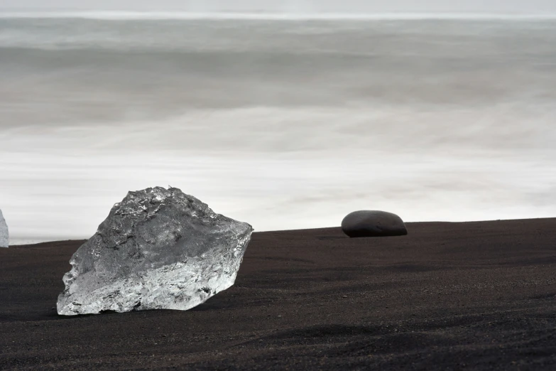 two rock formations in a black field