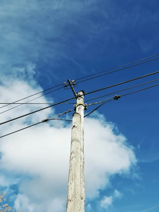 electrical wire and power lines stretching up into the sky