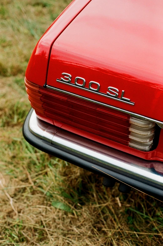 the rear end of an older red car