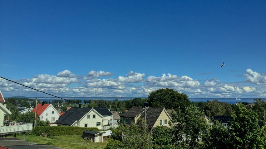 an apartment building in front of a scenic city skyline