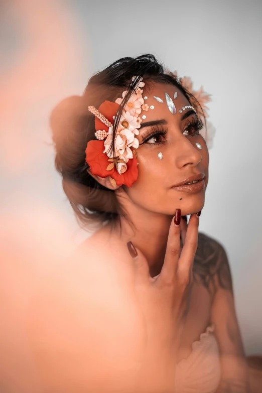 a woman wearing an unusual head piece with flowers