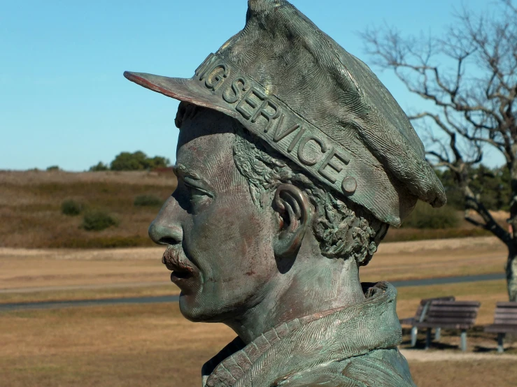 the bronze statue of an officer in uniform