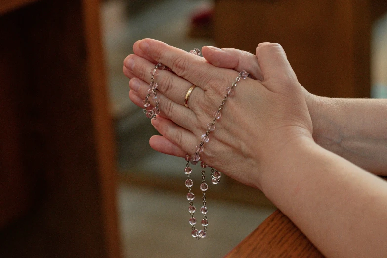 a hand that has some kind of jewelry on it