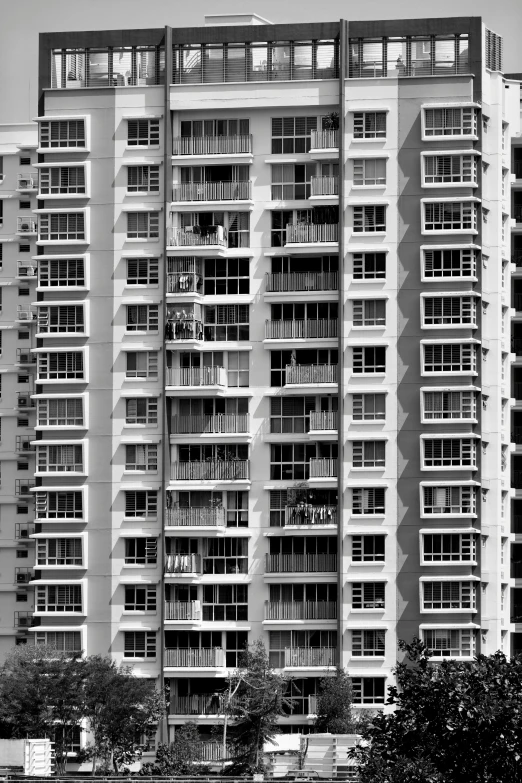 an apartment building that looks old and has windows and balconies