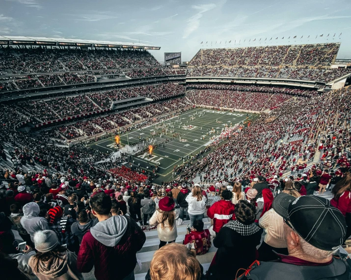 many people are sitting in seats in the stadium