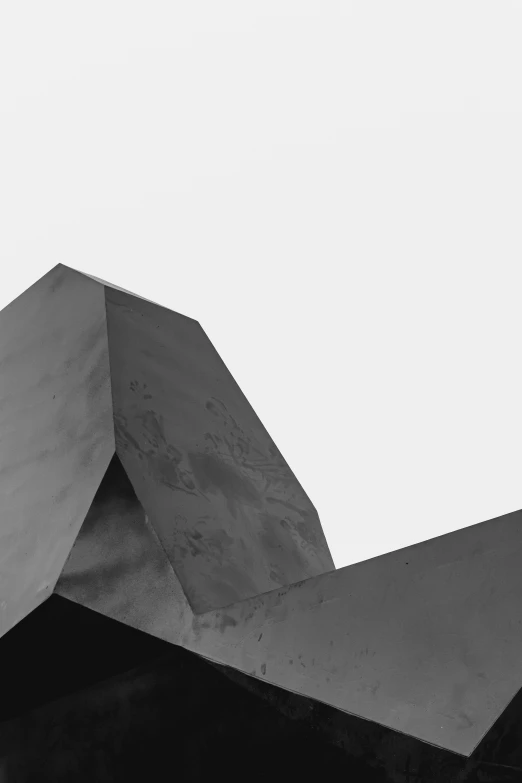 black and white po of concrete roof with a lone object in background