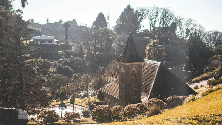 an old church sits in a forested area