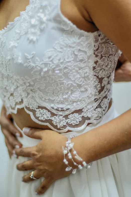 woman in a wedding dress poses for the camera