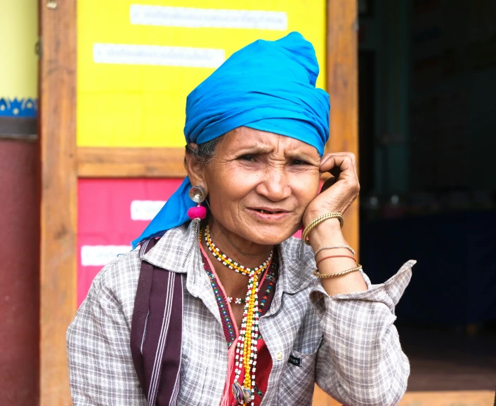 an indian woman talks on her cell phone