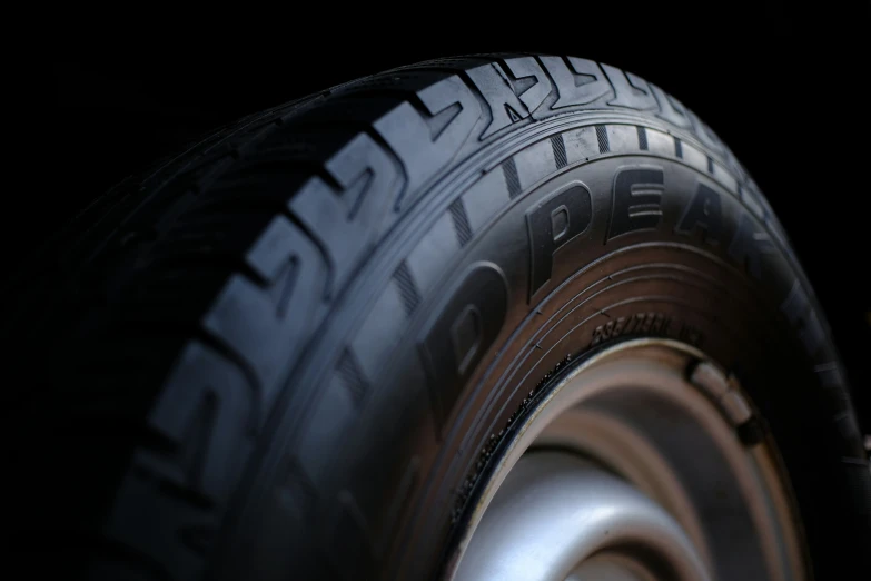 a tire from a car that is shiny and shiny