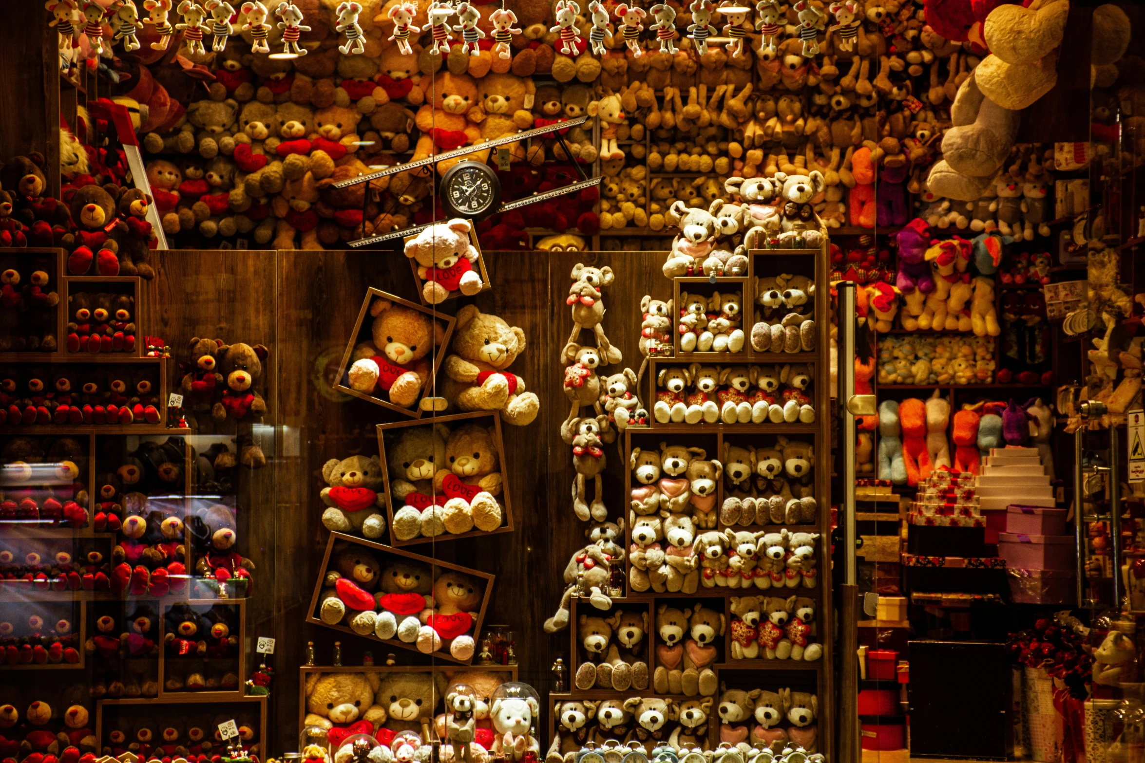 teddy bears and other stuff animals at a store