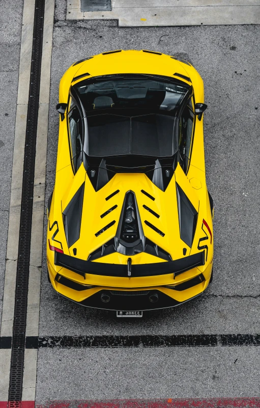 an overhead s of the yellow sports car