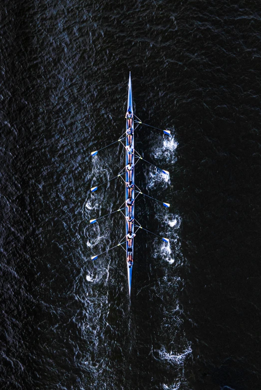 two small boats floating on top of a body of water