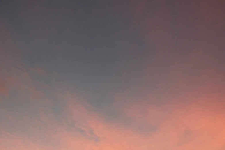 a plane flying high up above the sun