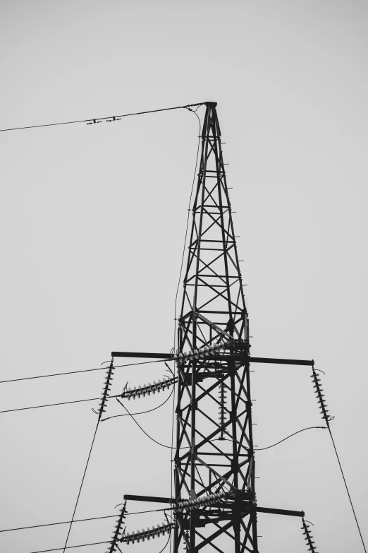 a tall tower that has some power lines next to it