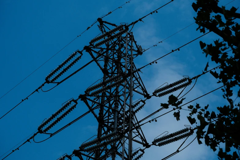 a tall tower that has lots of power lines