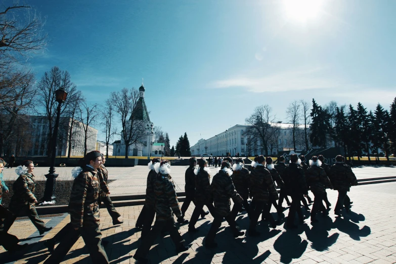 there are many people walking in the street together