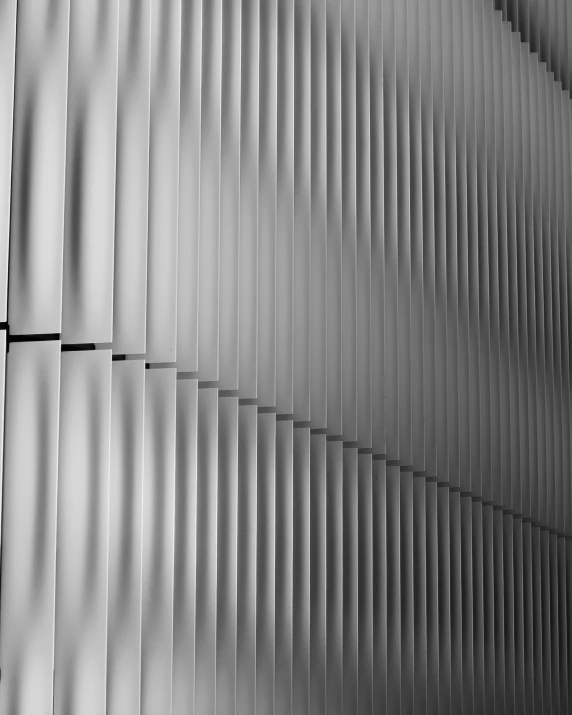 a long wall covered in lines and metal