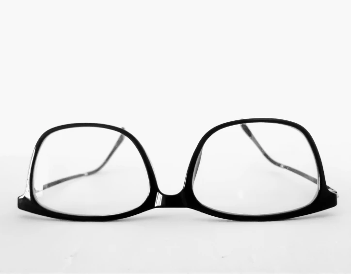 the pair of glasses is sitting on a table